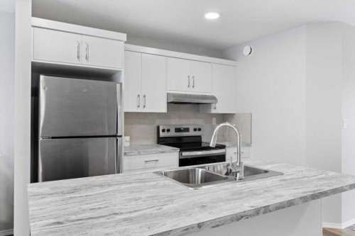 47 Louis Drive, Rural Red Deer County, AB - Indoor Photo Showing Kitchen With Double Sink With Upgraded Kitchen