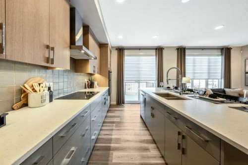 154 Osprey Hill Way Sw, Calgary, AB - Indoor Photo Showing Kitchen With Double Sink With Upgraded Kitchen
