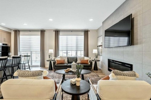 154 Osprey Hill Way Sw, Calgary, AB - Indoor Photo Showing Living Room With Fireplace