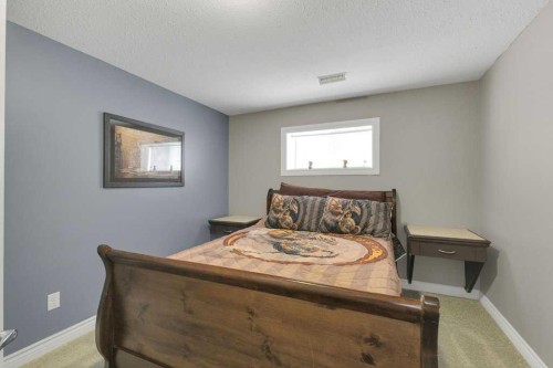 9 Pickering Close, Sylvan Lake, AB - Indoor Photo Showing Bedroom