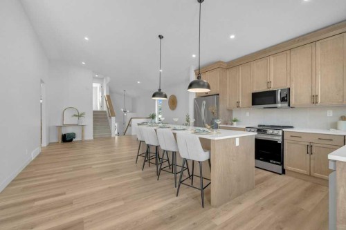 148 Red Ash Cove, Springbrook, AB - Indoor Photo Showing Kitchen With Upgraded Kitchen