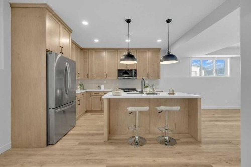 148 Red Ash Cove, Springbrook, AB - Indoor Photo Showing Kitchen With Upgraded Kitchen