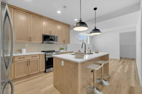 148 Red Ash Cove, Springbrook, AB - Indoor Photo Showing Kitchen With Upgraded Kitchen