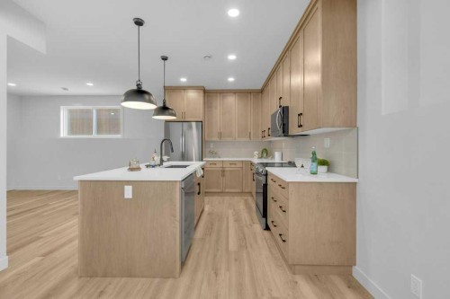 148 Red Ash Cove, Springbrook, AB - Indoor Photo Showing Kitchen With Upgraded Kitchen