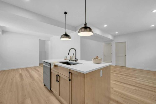 148 Red Ash Cove, Springbrook, AB - Indoor Photo Showing Kitchen With Double Sink