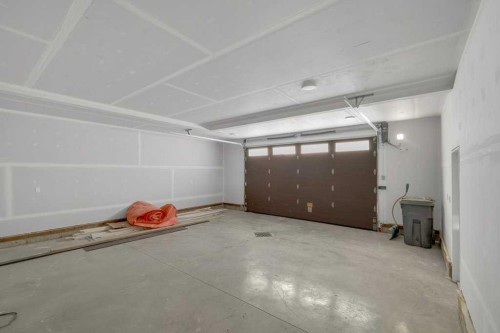 148 Red Ash Cove, Springbrook, AB - Indoor Photo Showing Garage