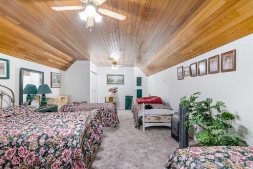 3 Rustic Road, Norglenwold, AB - Indoor Photo Showing Bedroom