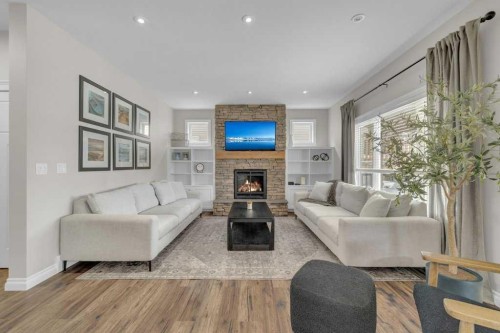 23 Bowman Circle, Sylvan Lake, AB - Indoor Photo Showing Living Room With Fireplace