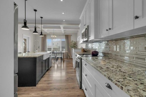 23 Bowman Circle, Sylvan Lake, AB - Indoor Photo Showing Kitchen With Upgraded Kitchen