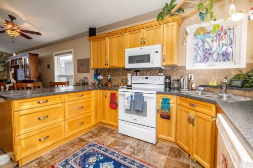 37 Regatta Way, Sylvan Lake, AB - Indoor Photo Showing Kitchen With Double Sink
