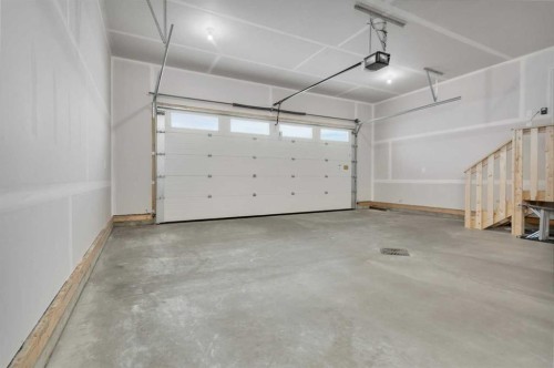 77 Maclean Close, Blackfalds, AB - Indoor Photo Showing Garage