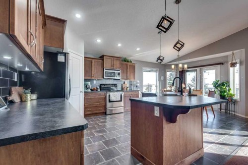 13 Heritage Drive, Penhold, AB - Indoor Photo Showing Kitchen With Double Sink