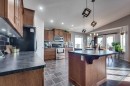 13 Heritage Drive, Penhold, AB  - Indoor Photo Showing Kitchen With Double Sink 