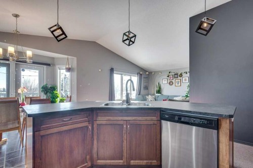 13 Heritage Drive, Penhold, AB - Indoor Photo Showing Kitchen With Double Sink