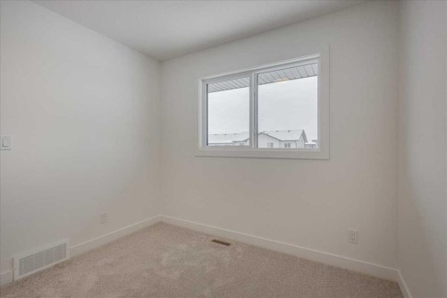32 Inglis Crescent, Sylvan Lake, AB - Indoor Photo Showing Other Room