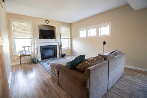 408-150 Vanier Drive, Red Deer, AB - Indoor Photo Showing Living Room With Fireplace