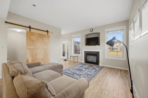408-150 Vanier Drive, Red Deer, AB - Indoor Photo Showing Living Room With Fireplace