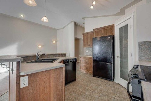 9 Assinger Avenue, Red Deer, AB - Indoor Photo Showing Kitchen With Double Sink