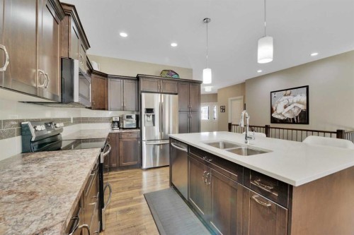 12 Rosse Place, Sylvan Lake, AB - Indoor Photo Showing Kitchen With Stainless Steel Kitchen With Double Sink With Upgraded Kitchen