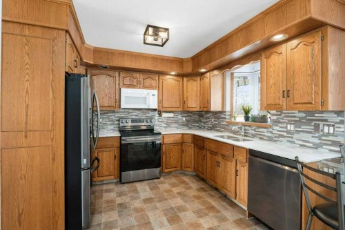 6418 55 Avenue, Ponoka, AB - Indoor Photo Showing Kitchen With Stainless Steel Kitchen With Double Sink