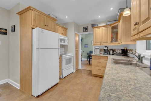 602 Partridge Drive, Pelican Point, AB - Indoor Photo Showing Kitchen With Double Sink