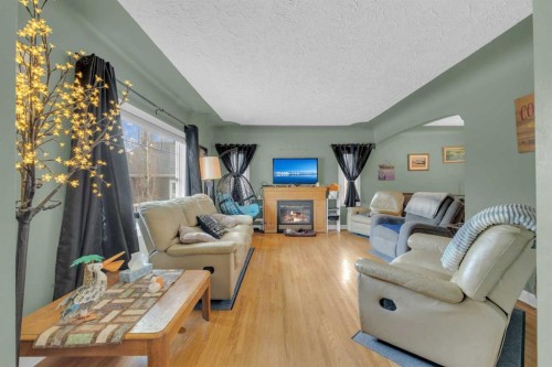 602 Partridge Drive, Pelican Point, AB - Indoor Photo Showing Other Room With Fireplace