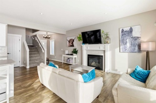 19 Vanveller Way, Sylvan Lake, AB - Indoor Photo Showing Living Room With Fireplace