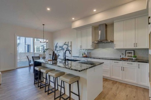 56 Dawson Wharf Mount, Chestermere, AB - Indoor Photo Showing Kitchen With Upgraded Kitchen