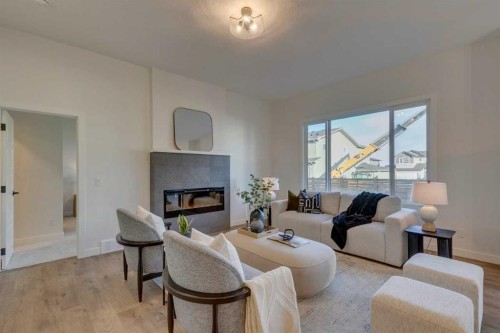 56 Dawson Wharf Mount, Chestermere, AB - Indoor Photo Showing Living Room With Fireplace