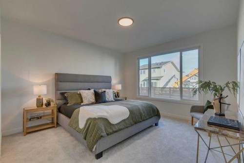 56 Dawson Wharf Mount, Chestermere, AB - Indoor Photo Showing Bedroom