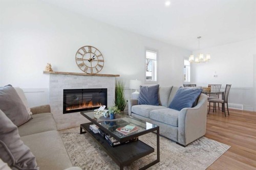 3-5324 49 Avenue, Lacombe, AB - Indoor Photo Showing Living Room With Fireplace