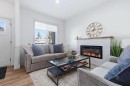 3-5324 49 Avenue, Lacombe, AB  - Indoor Photo Showing Living Room With Fireplace 
