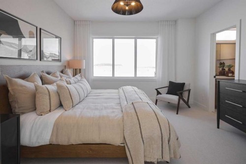 58 Raven Point Se, Calgary, AB - Indoor Photo Showing Bedroom
