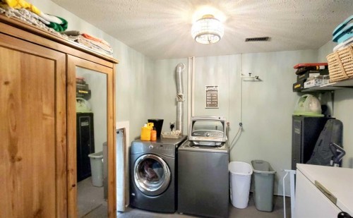 2 Westheights Drive, Didsbury, AB - Indoor Photo Showing Laundry Room