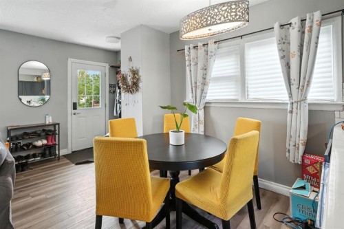 4910 53 Avenue, Rimbey, AB - Indoor Photo Showing Dining Room With Fireplace