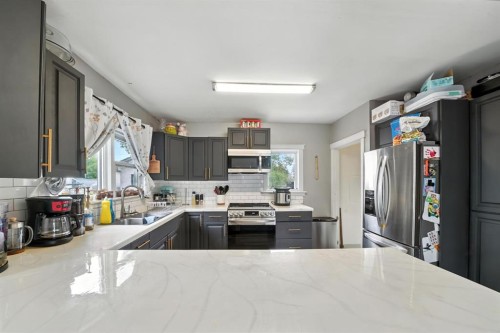4910 53 Avenue, Rimbey, AB - Indoor Photo Showing Kitchen With Double Sink