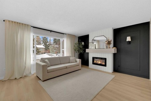 42 Valley Crescent, Lacombe, AB - Indoor Photo Showing Living Room With Fireplace