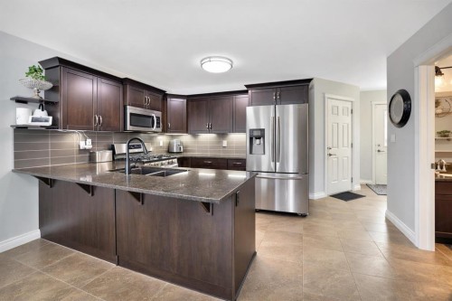 74 Van Slyke Way, Red Deer, AB - Indoor Photo Showing Kitchen With Double Sink With Upgraded Kitchen