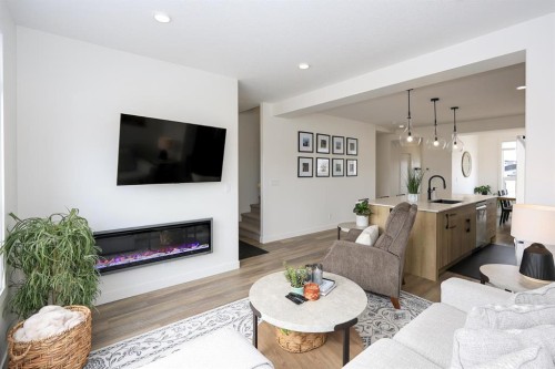 E-2 Evergreen Way, Red Deer, AB - Indoor Photo Showing Living Room With Fireplace