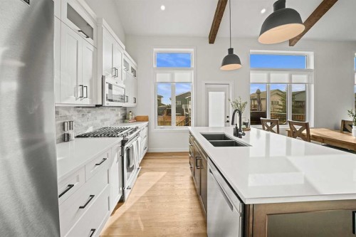 37 Arrowwood Close, Blackfalds, AB - Indoor Photo Showing Kitchen With Double Sink With Upgraded Kitchen