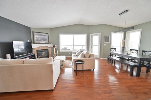77 Pondside Crescent, Blackfalds, AB - Indoor With Fireplace