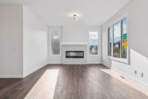 215 Sora Terrace Se, Calgary, AB - Indoor Photo Showing Living Room With Fireplace