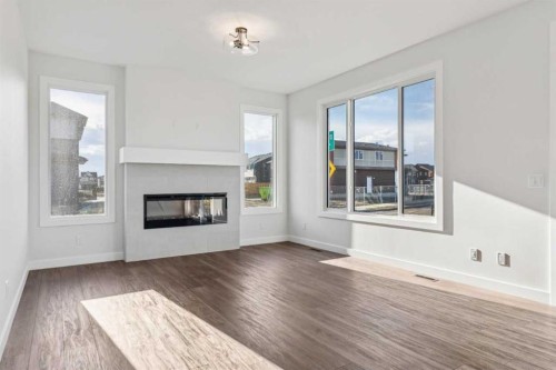 215 Sora Terrace Se, Calgary, AB - Indoor Photo Showing Living Room With Fireplace