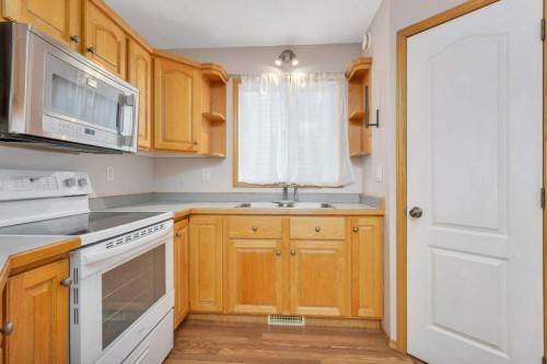 220 Deschner Close, Red Deer, AB - Indoor Photo Showing Kitchen With Double Sink