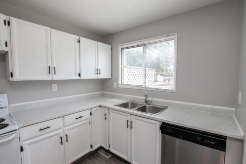 36 Mcblane Close, Red Deer, AB - Indoor Photo Showing Kitchen With Double Sink