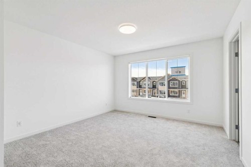 15 Emberside Park, Cochrane, AB - Indoor Photo Showing Other Room