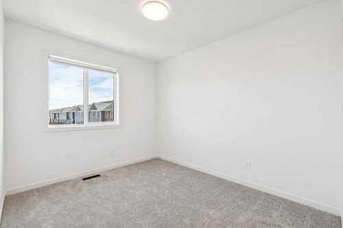 15 Emberside Park, Cochrane, AB - Indoor Photo Showing Other Room