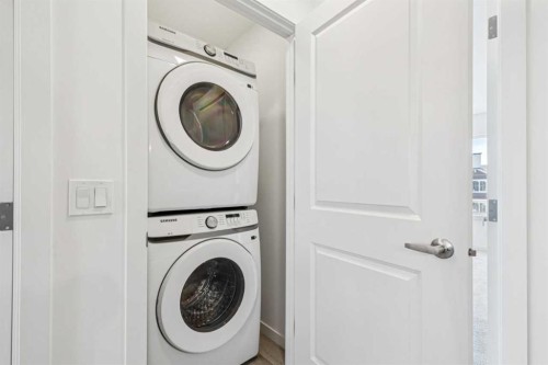 15 Emberside Park, Cochrane, AB - Indoor Photo Showing Laundry Room