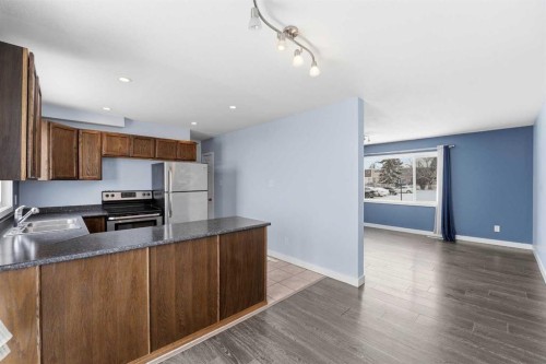 110 Terrace Park, Red Deer, AB - Indoor Photo Showing Kitchen With Double Sink