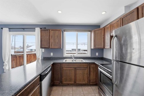 110 Terrace Park, Red Deer, AB - Indoor Photo Showing Kitchen With Stainless Steel Kitchen With Double Sink